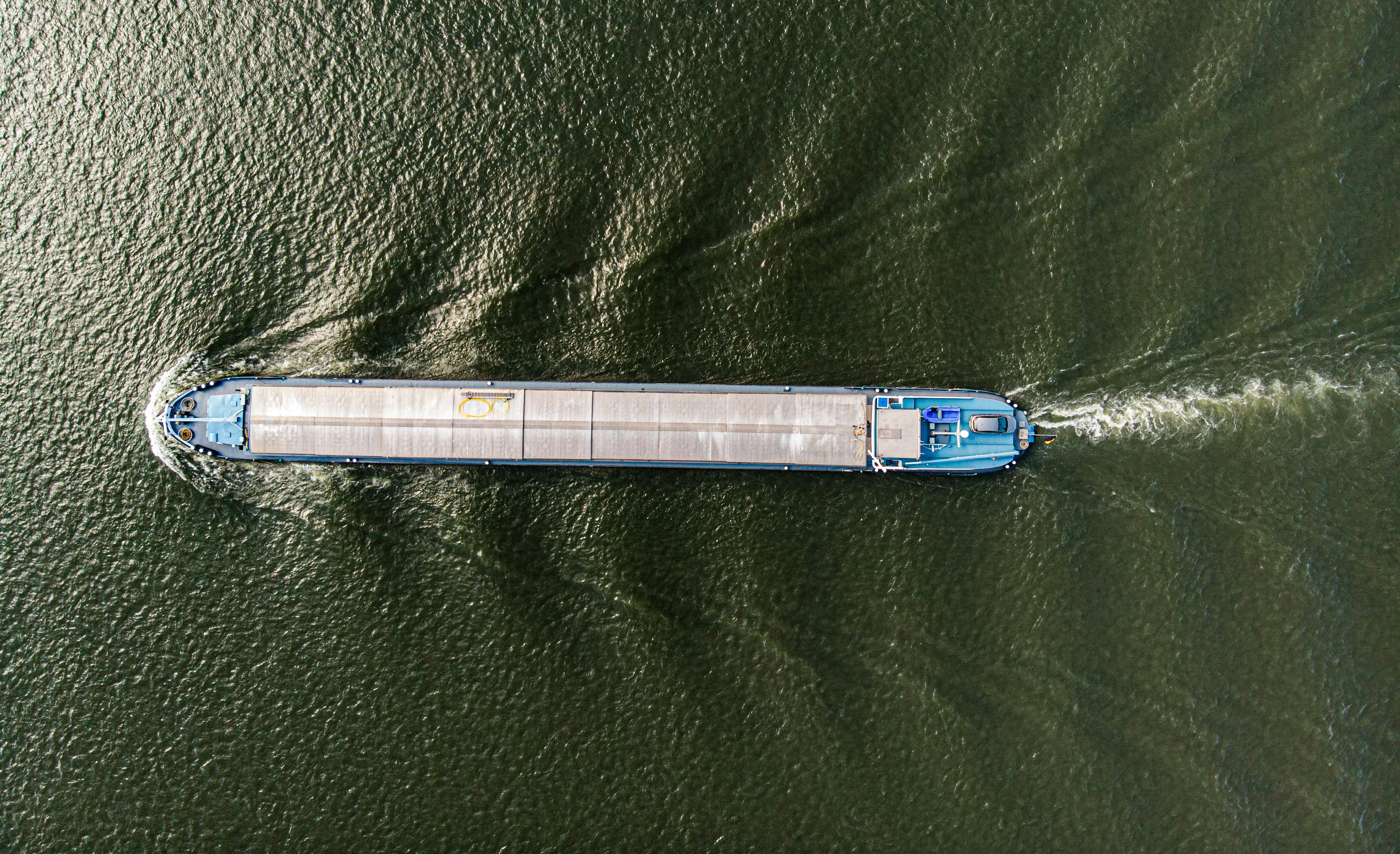 Aerial view of cargo barge on inland waterway