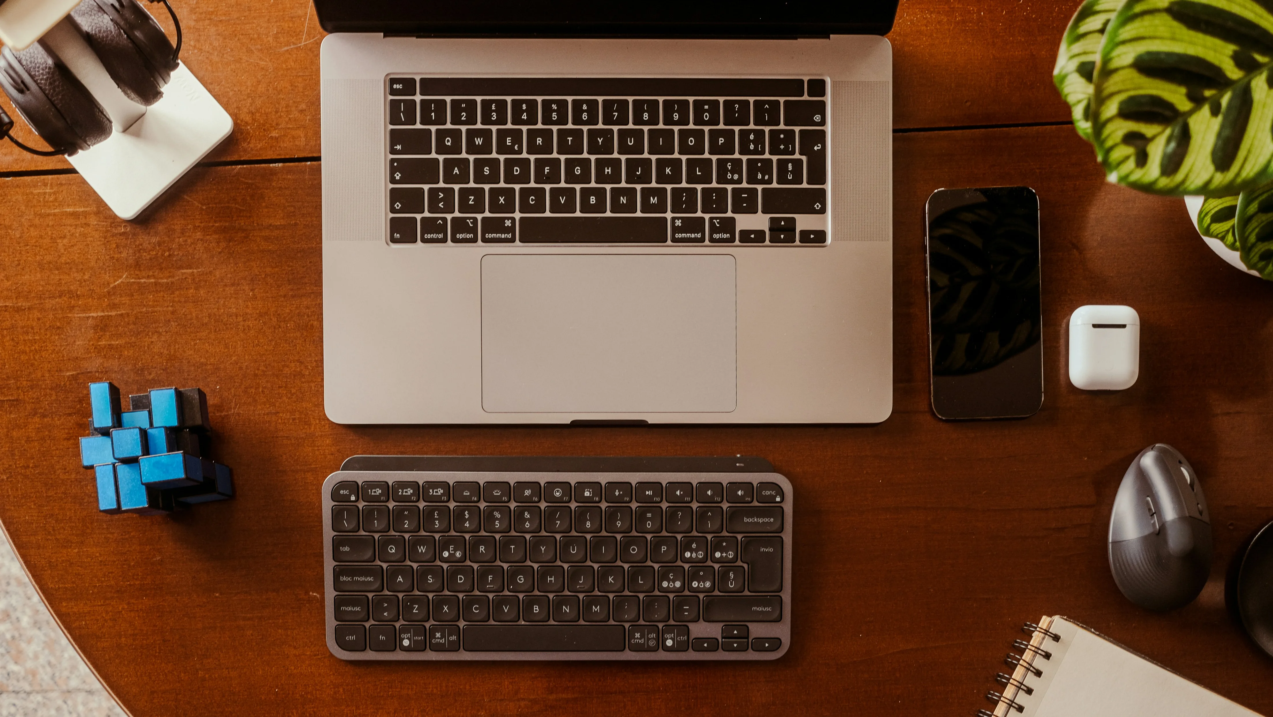 Consumer electronics flat lay with laptop, phone, and accessories