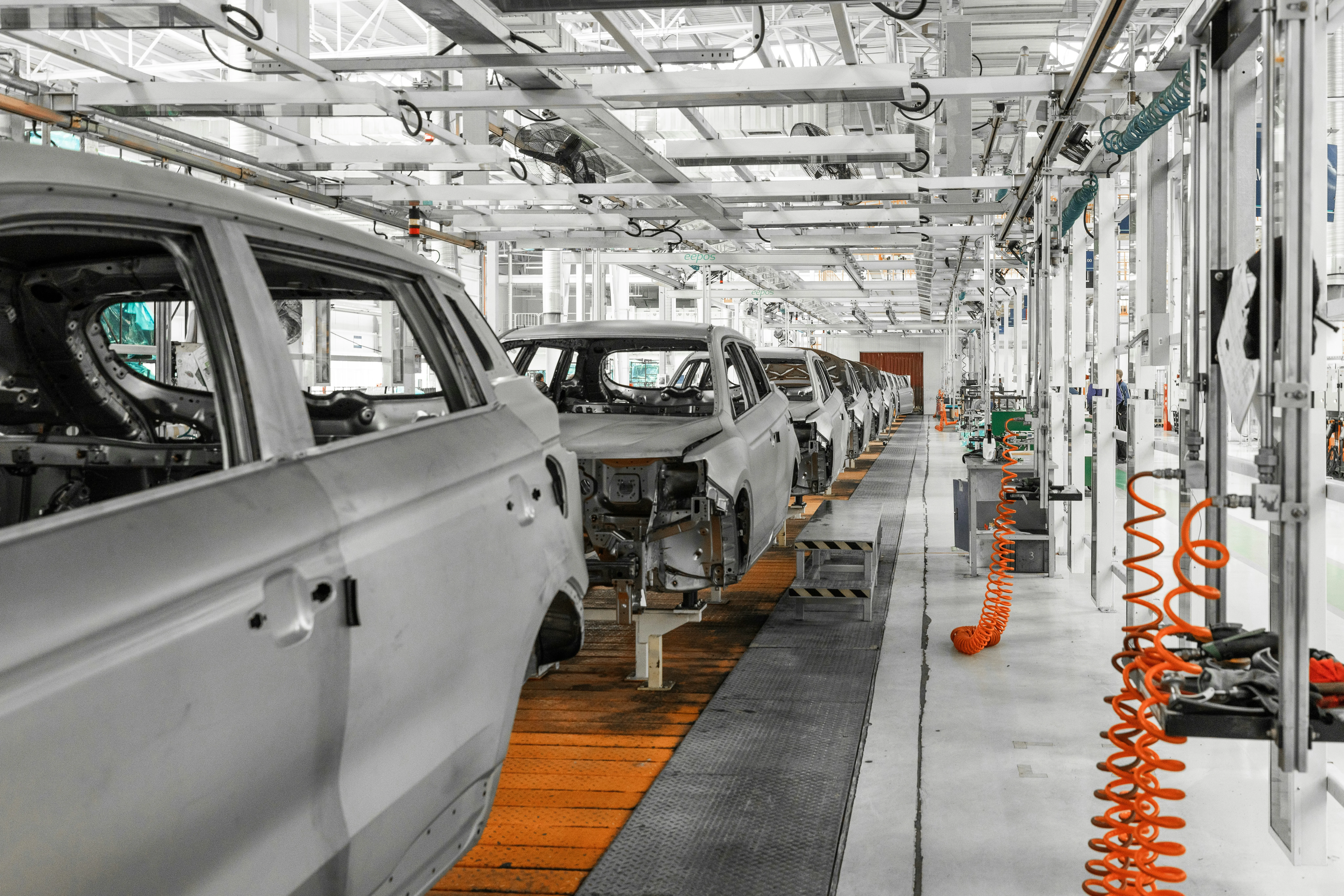 SUV assembly line with production stations in automotive factory