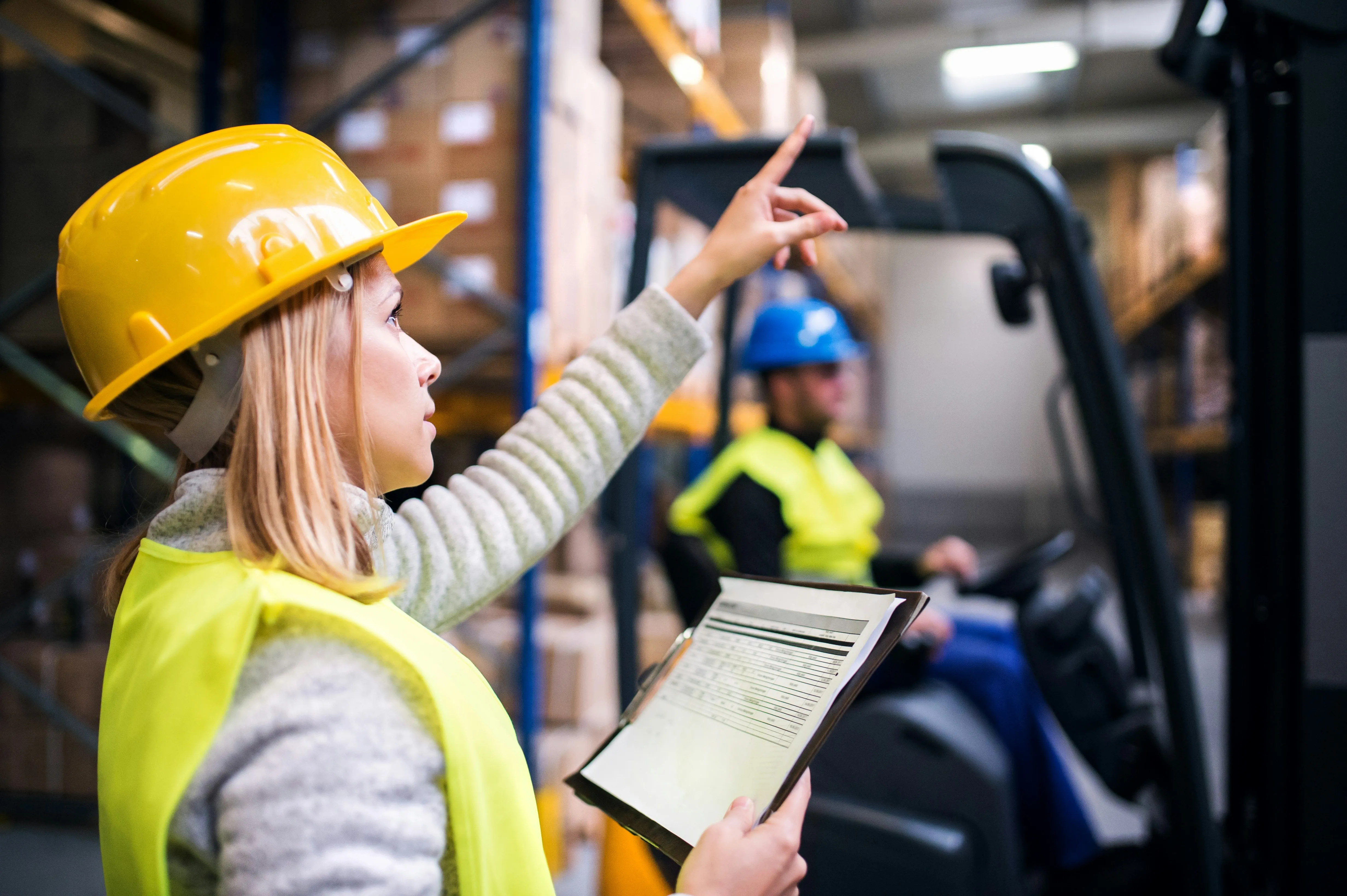 Warehouse supervisor directing operations