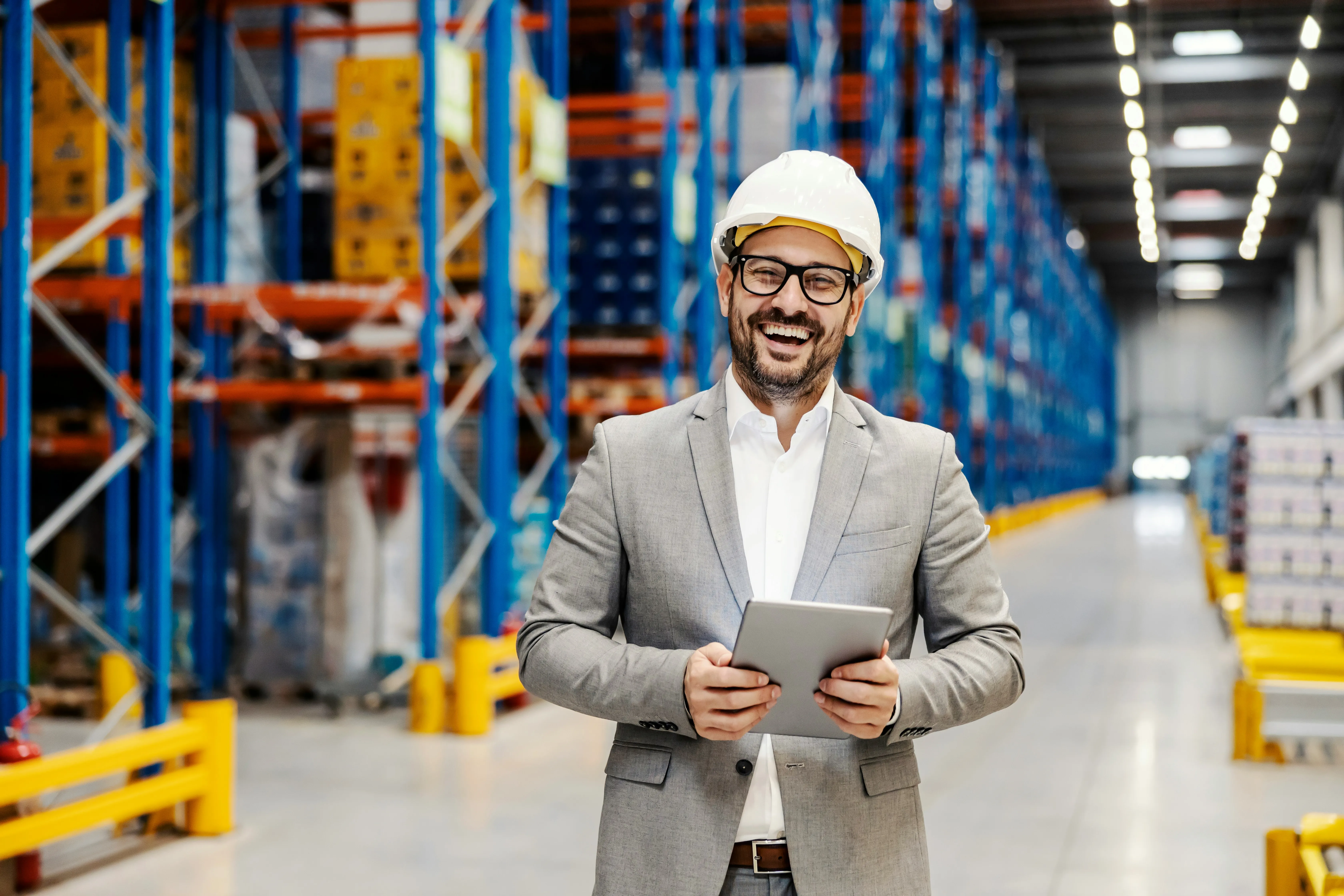 Warehouse manager with tablet on the operations floor