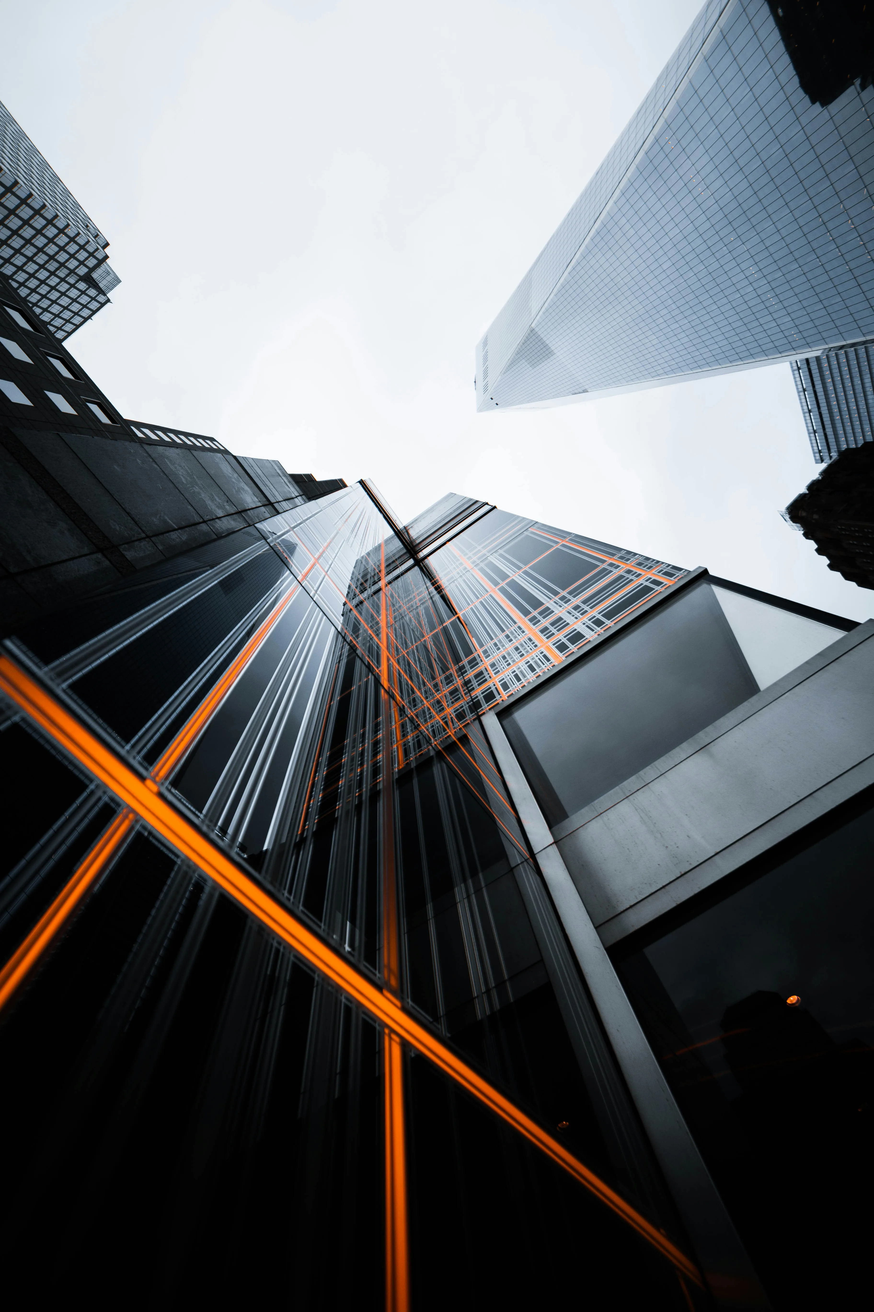 Modern glass skyscrapers with dramatic lighting