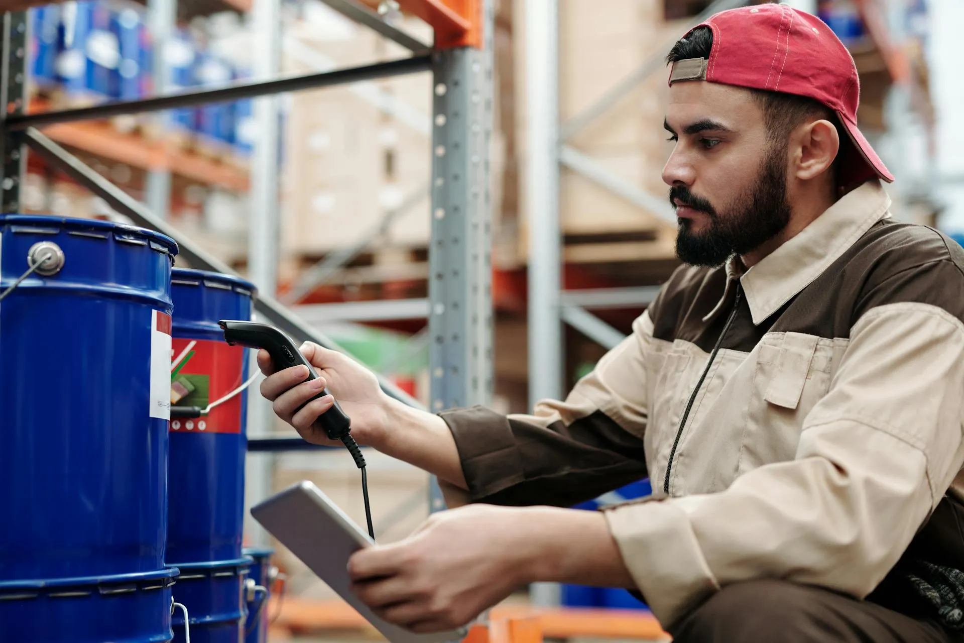 Worker using handheld scanner in warehouse