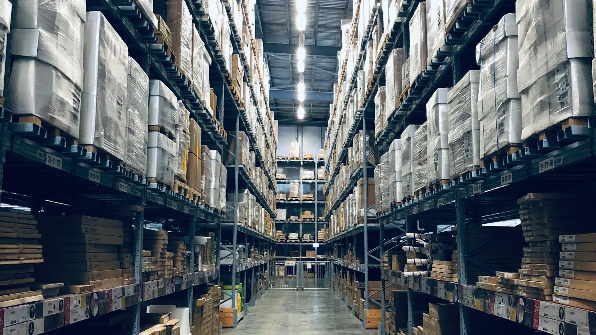 Warehouse worker scanning inventory with technology